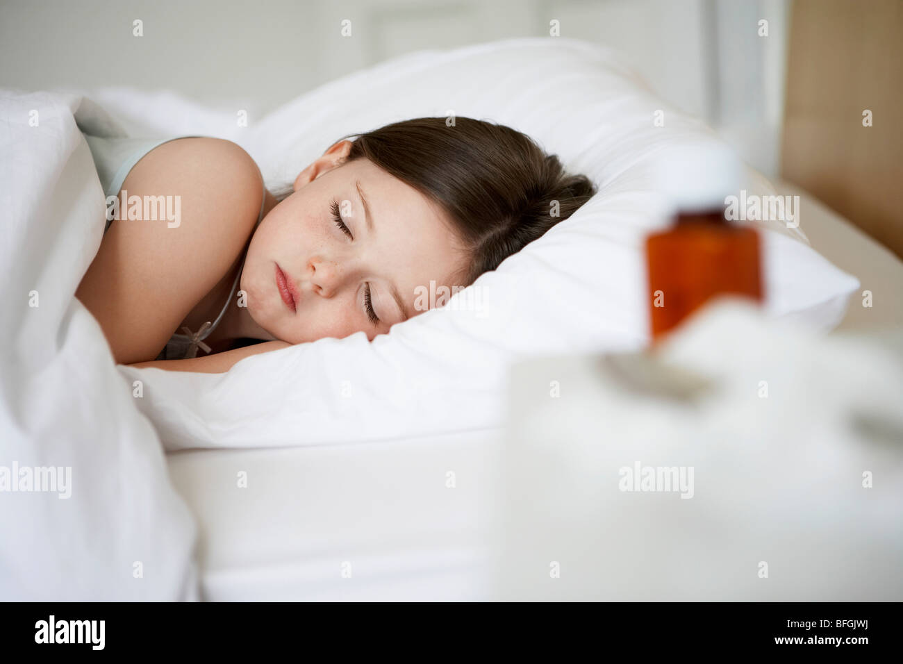 Little with cold in bed sleeping, close up Stock Photo Alamy