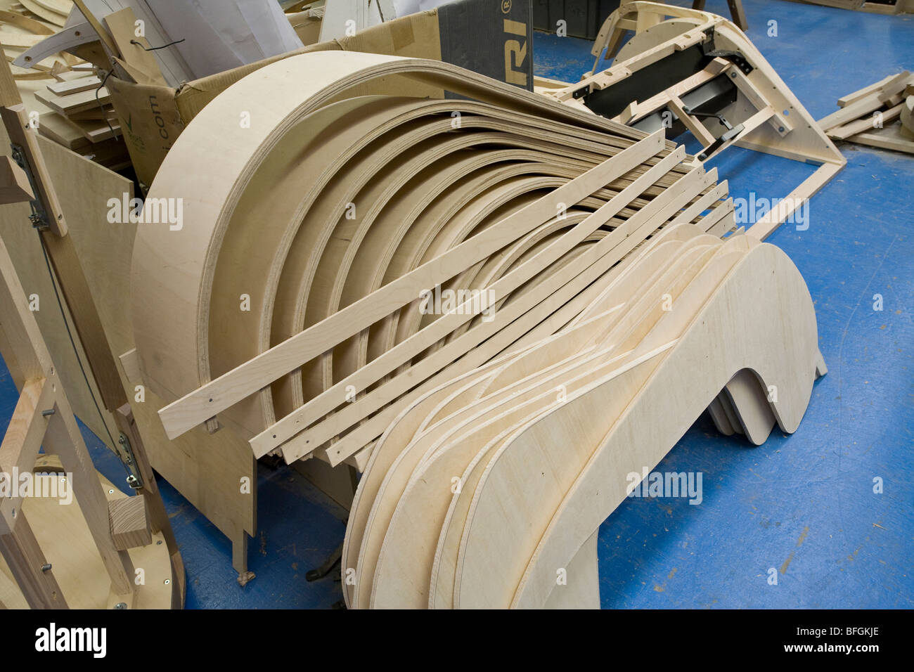 Shaped wheel arches in plywood at the Motor Motor Car Company, Malvern Link, Worcestershire, UK. Stock Photo