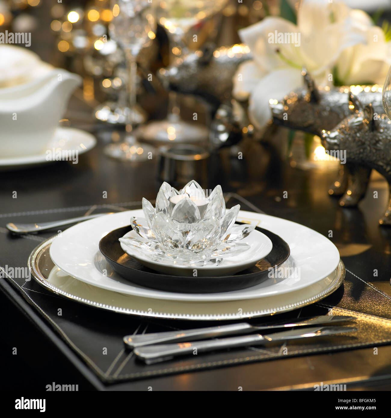 Table setting with dinner plate and crystal votive candle holder Stock