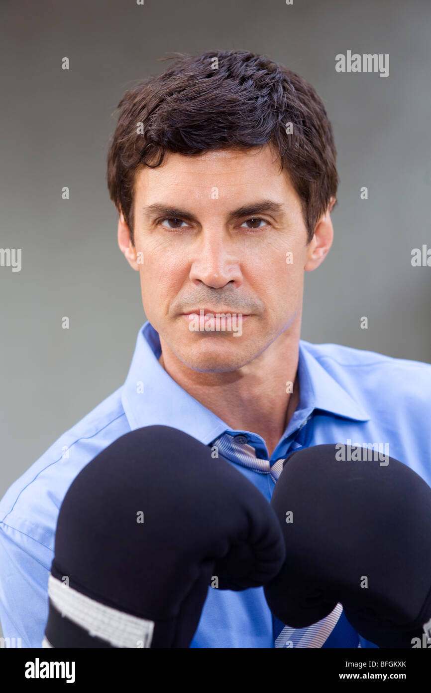 Portrait of a businessman wearing boxing gloves Stock Photo