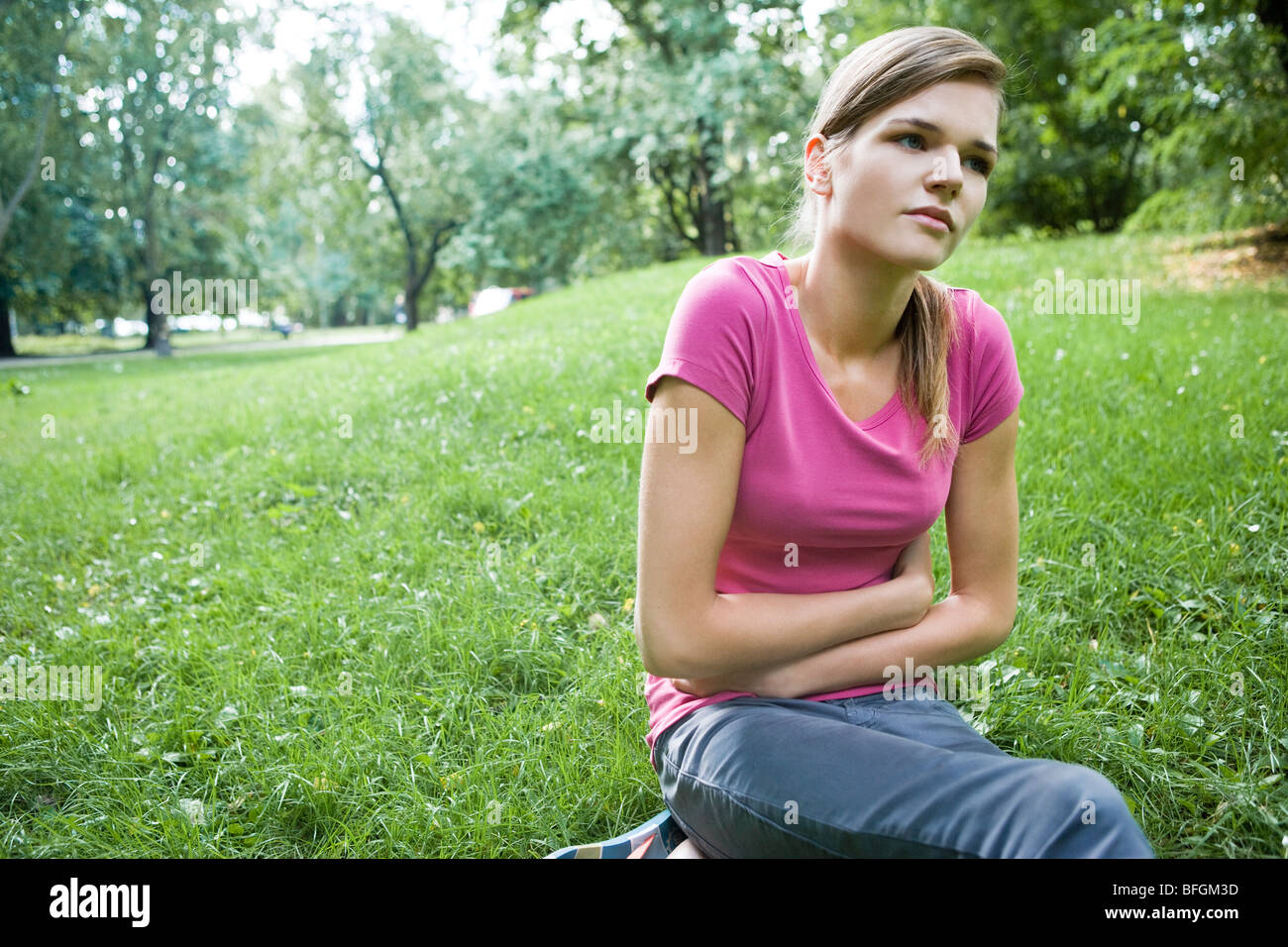 young-woman-with-stomach-ache-stock-photo-alamy