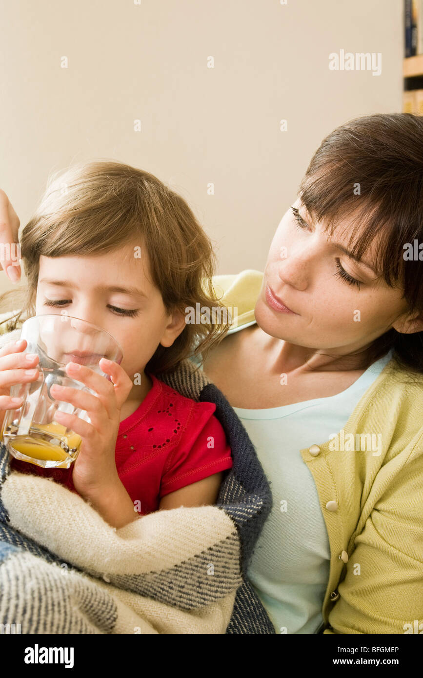 sick girl drinking juice Stock Photo Alamy