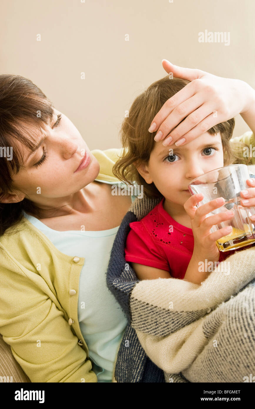 sick girl drinking juice Stock Photo Alamy