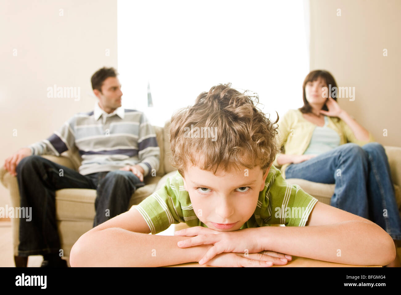 parents arguing in front of child Stock Photo
