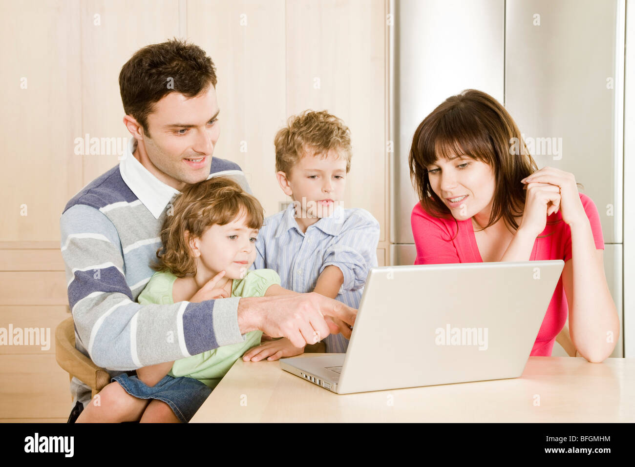 family using computer Stock Photo - Alamy