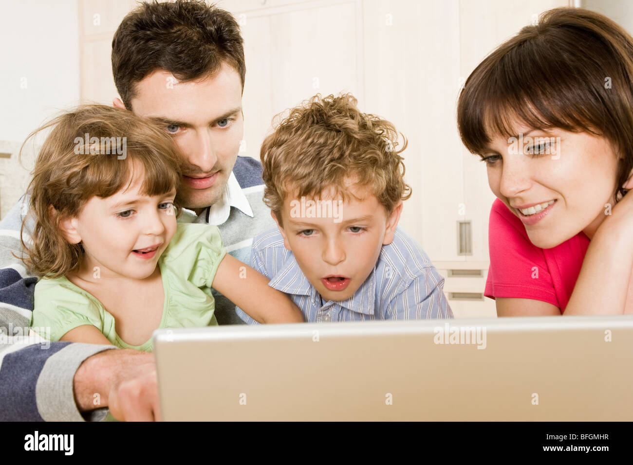 family using computer Stock Photo Alamy