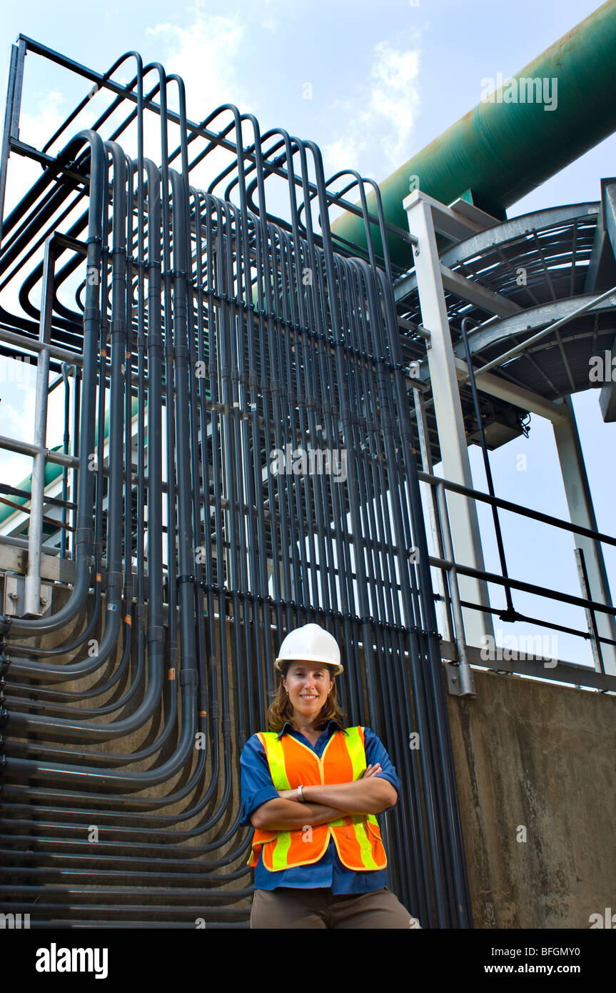 Female civil engineer standing in front of water filtration system, Chapel Hill, North Carolina Stock Photo