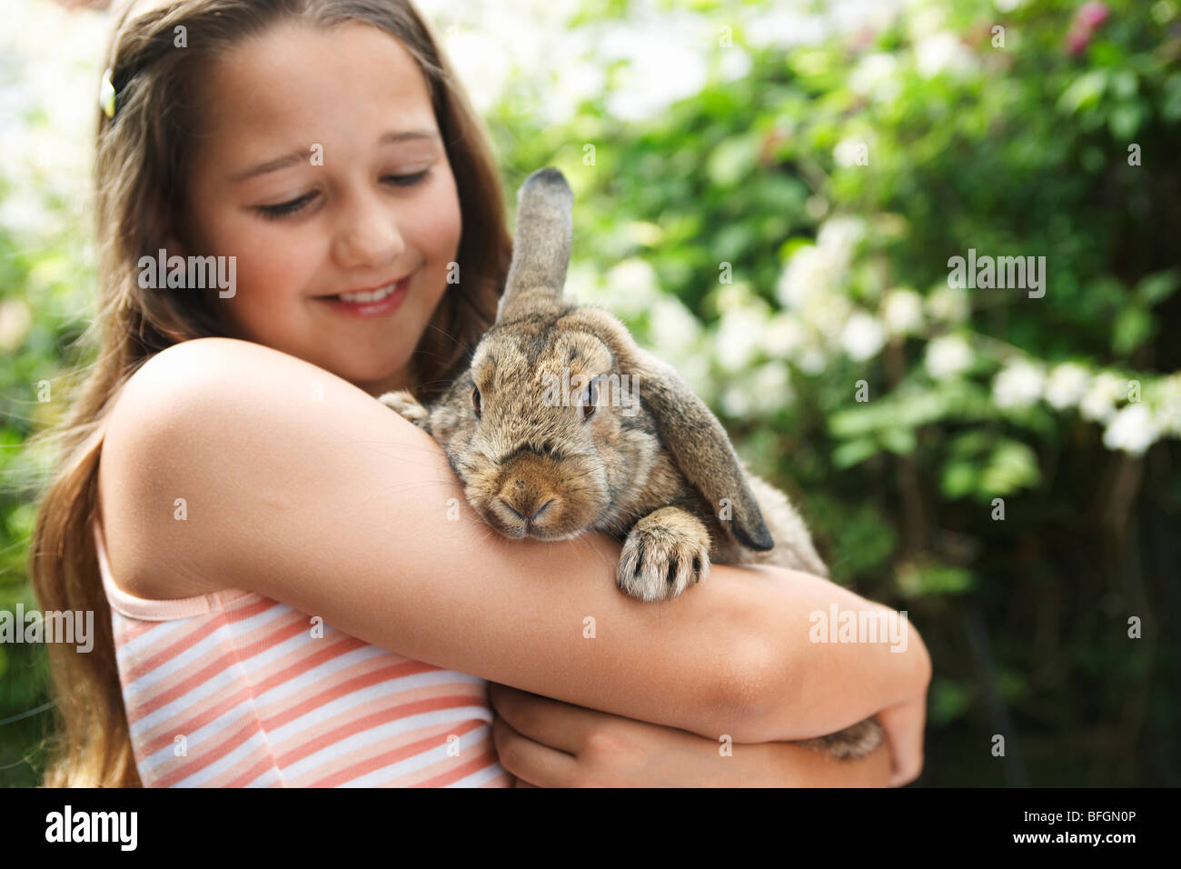 Girl Holding Rabbit Stock Photo - Alamy