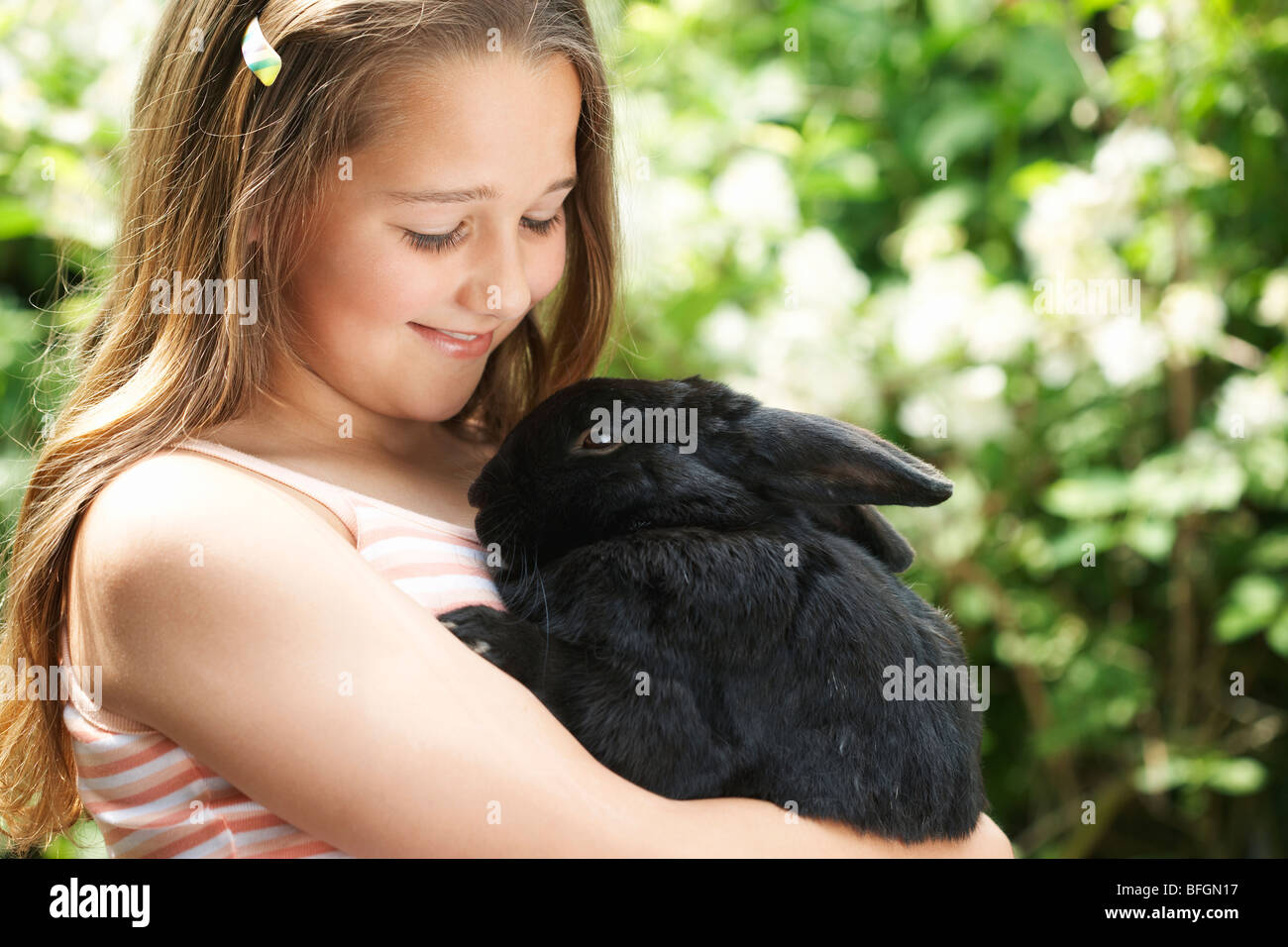 Girl Holding Rabbit Stock Photo - Alamy