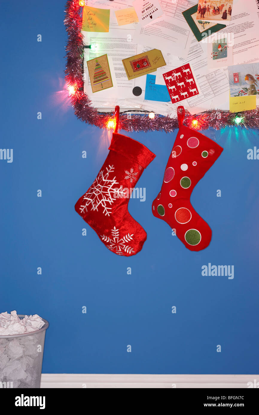 Christmas stocking decorations hanging on wall Stock Photo Alamy