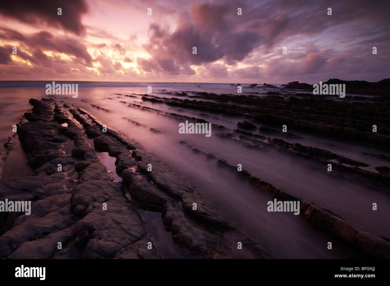 Sunset over Welcombe Mouth rocks on the North Devon coast UK Stock