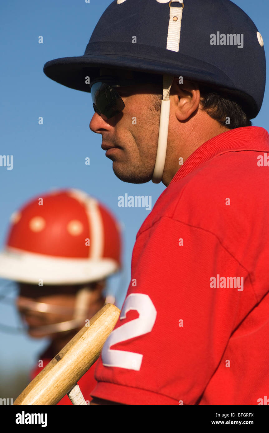 Polo player wearing helmet Stock Photo Alamy