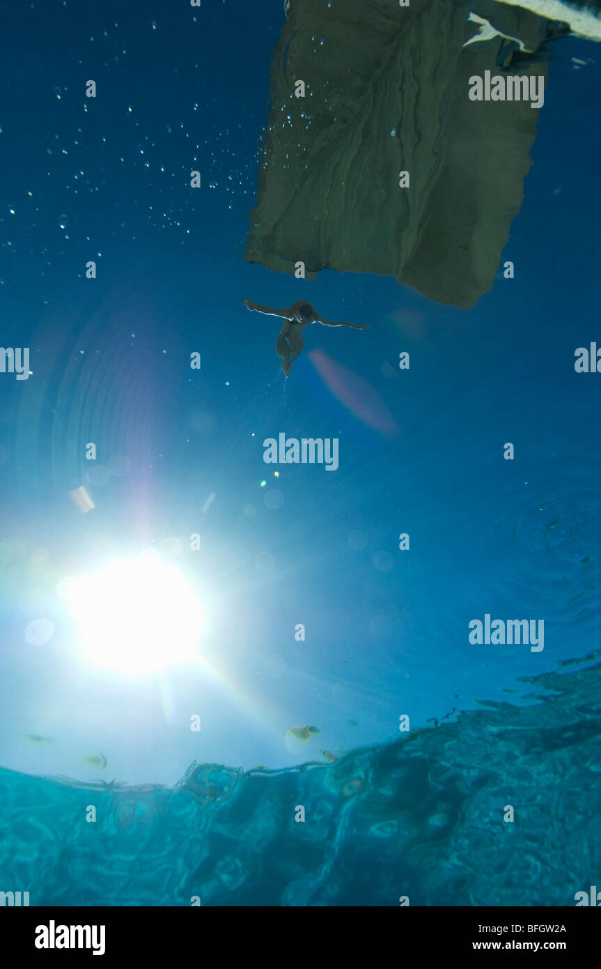 Swimmer jumping from diving board, underwater view Stock Photo Alamy