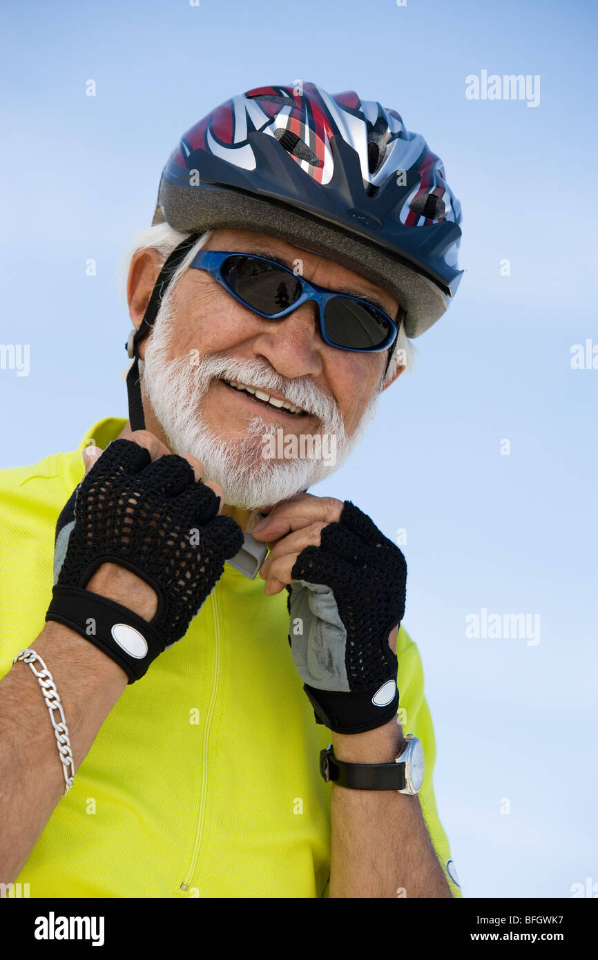 Senior man adjusting sunglasses hi-res stock photography and images - Alamy