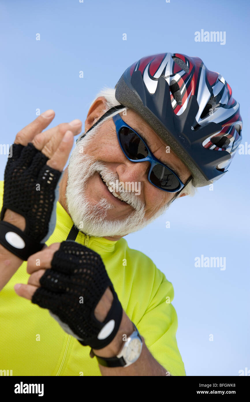 Senior man adjusting sunglasses hi-res stock photography and images - Alamy