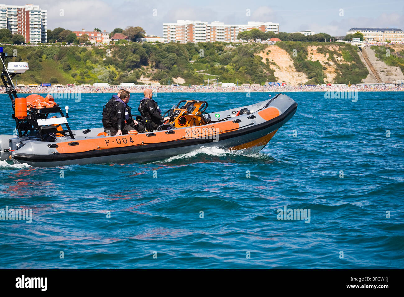 Officers from the Dorset Police Marine Section, patrol off shore along Bournemouth beach and seafront, Dorset. UK. Summer. Stock Photo