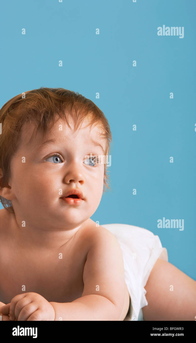 Baby wearing nappy lying on tummy Stock Photo Alamy