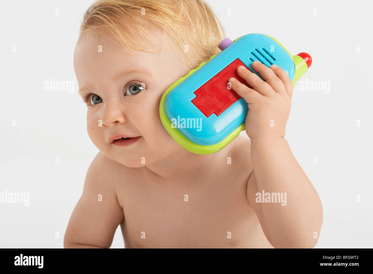 Baby Listening To Toy Telephone Stock Photo Alamy