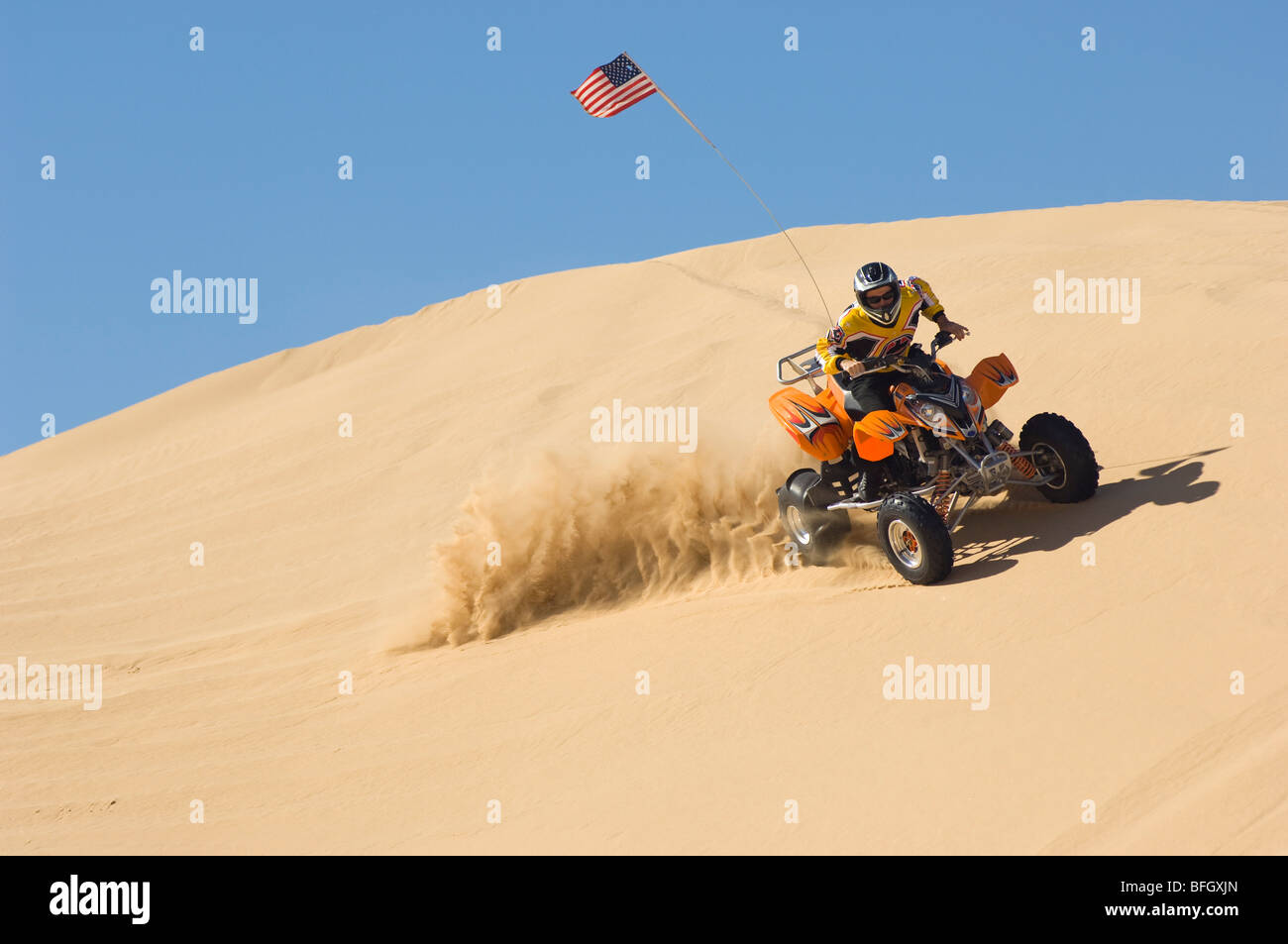 Young Man Riding ATV Over Sand Dune Stock Photo Alamy