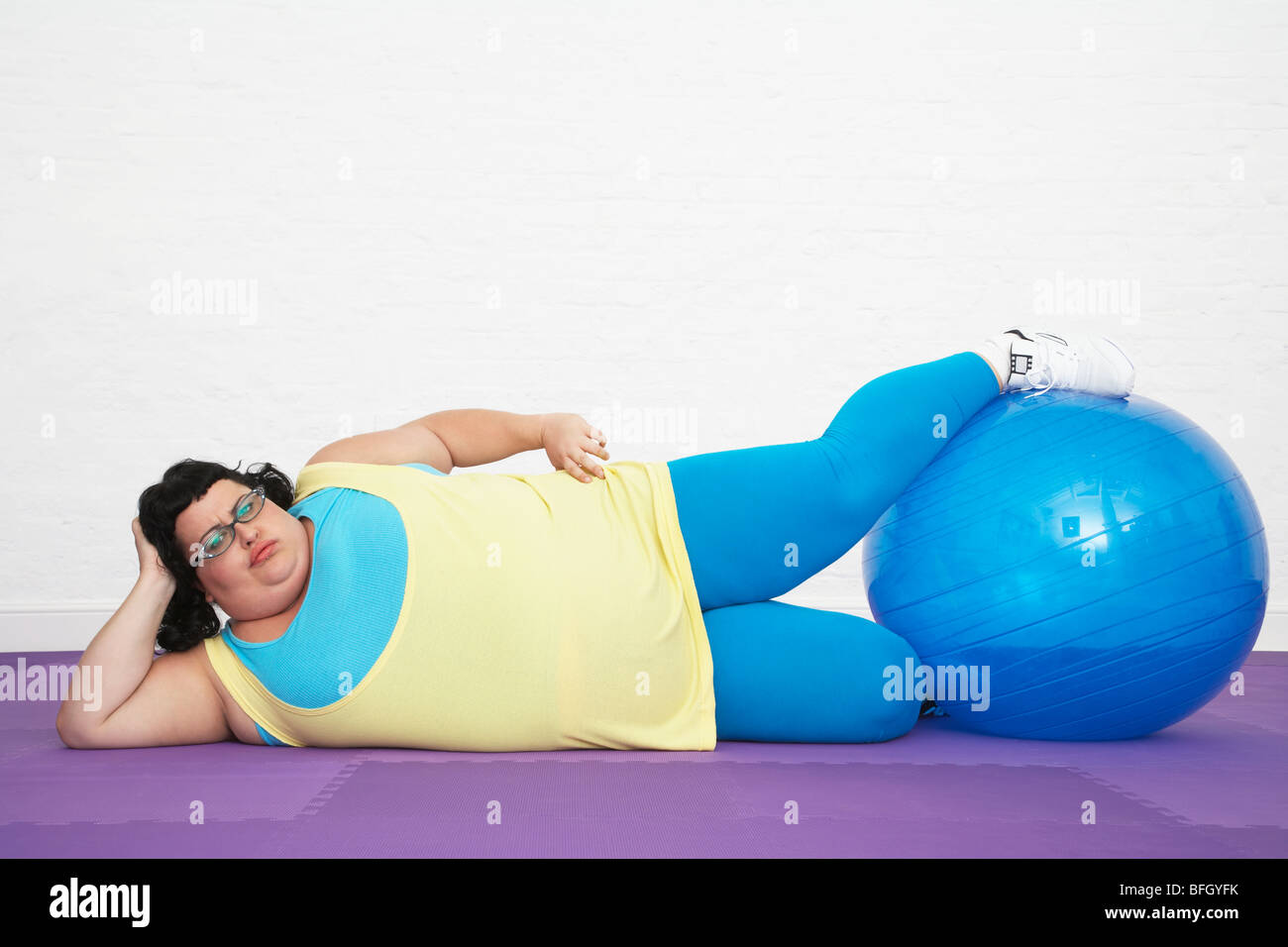 Overweight Woman Doing Gymnastics Stock Photo