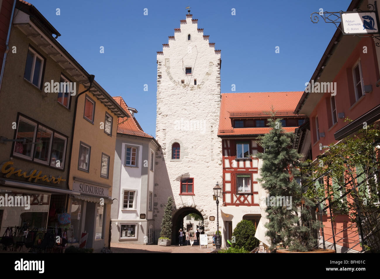 Marktstrasse, Markdorf, Baden-Wurttemberg, Germany. Old gateway and large sundial on cobbled street within Altstadt town walls Stock Photo