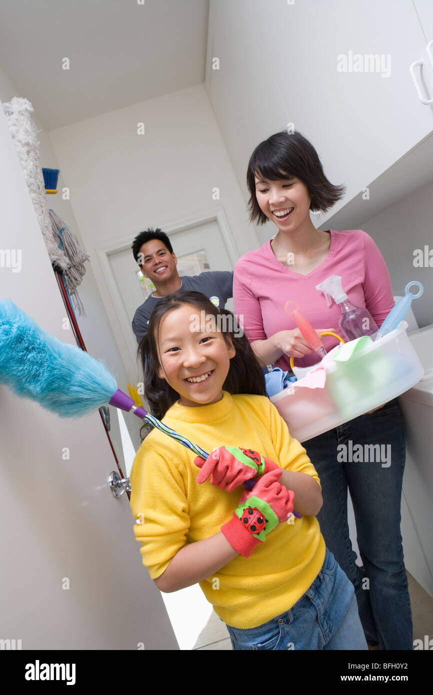 Family with girl (10-12) doing housework Stock Photo - Alamy