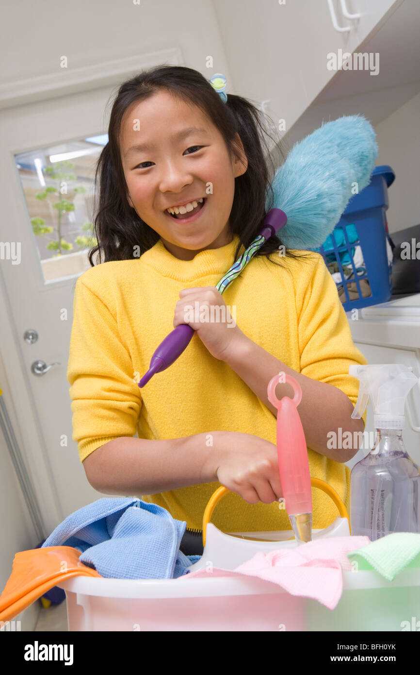 Girl (10-12) doing housework Stock Photo - Alamy