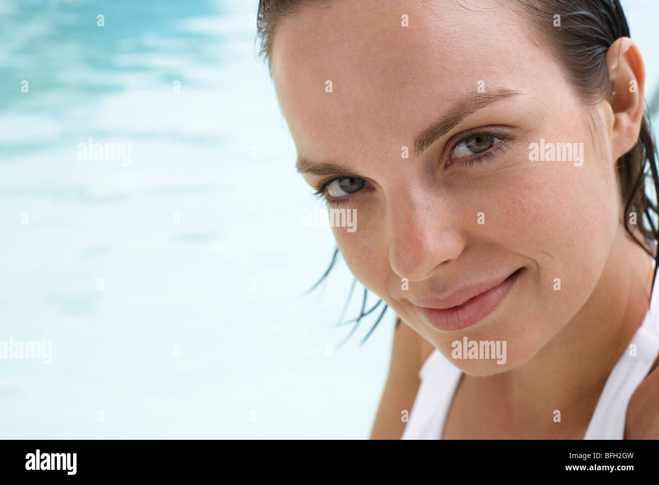 Young woman relaxing in swimming pool, portrait Stock Photo - Alamy