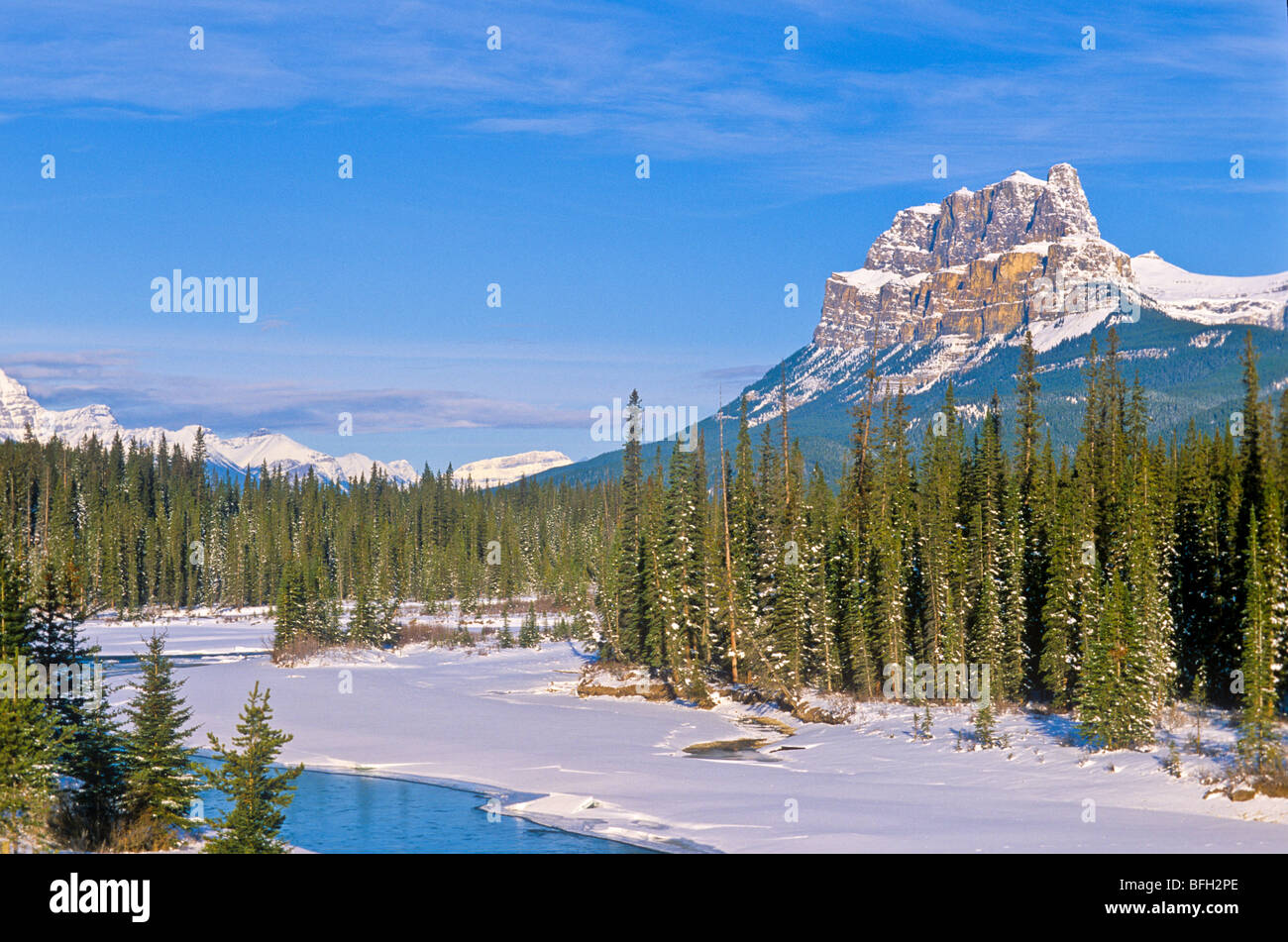 River flowing in front of snow covered Castle Mountain. Banff National Park, Alberta, Canada Stock Photo
