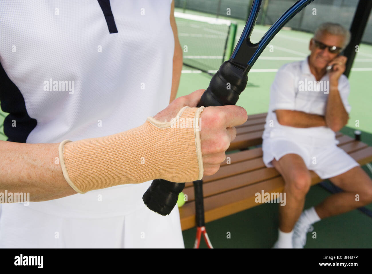 Tennis player wearing wristband Stock Photo Alamy