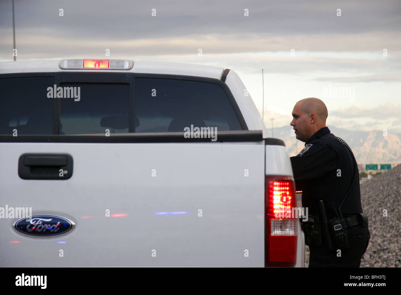 Nevada Highway Patrol State Trooper speaking with a driver stopped for a traffic offence. Stock Photo