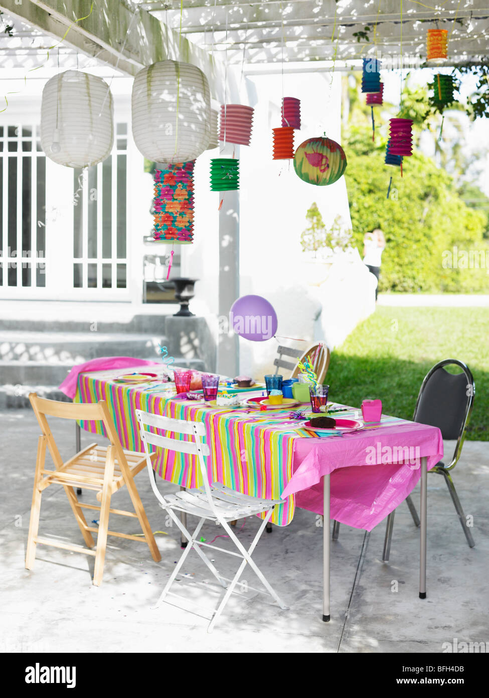 Table and decorated patio after birthday party Stock Photo Alamy