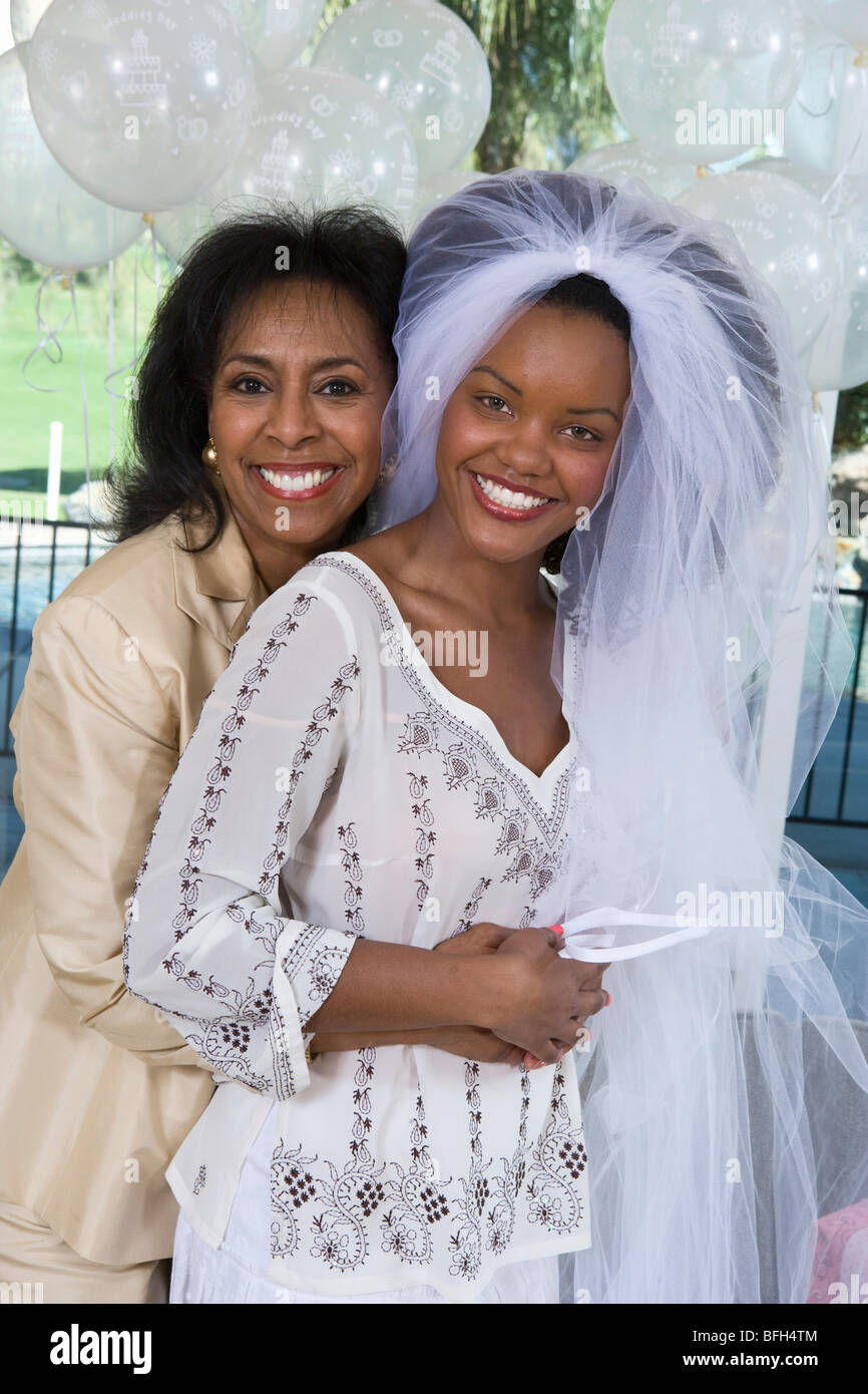 Mother embracing her daughter at bridal shower Stock Photo Alamy