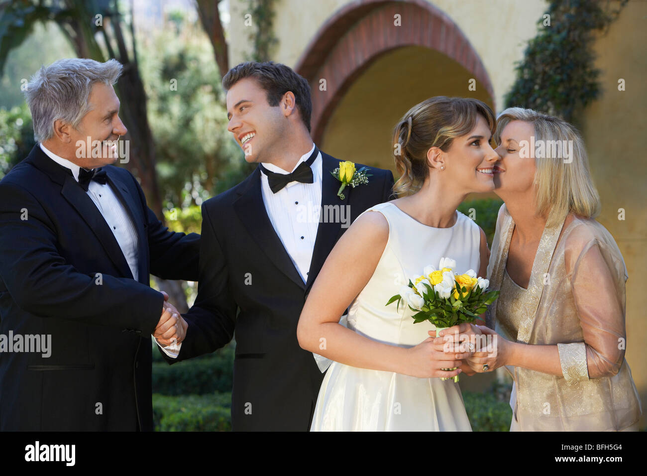 Bride, groom and parents exchanging wishes Stock Photo Alamy