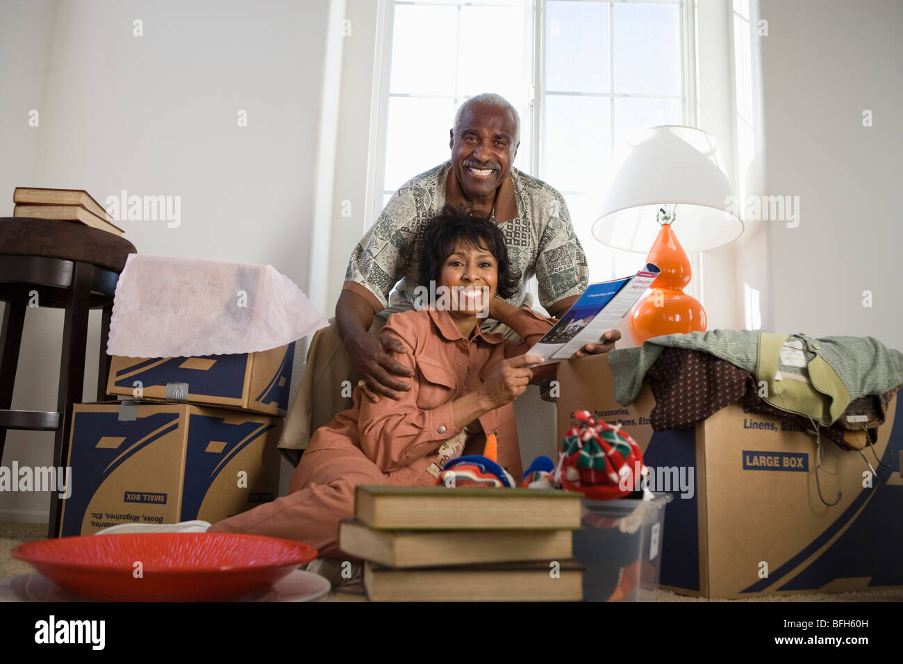 Portrait of middle-aged couple in new apparent Stock Photo - Alamy