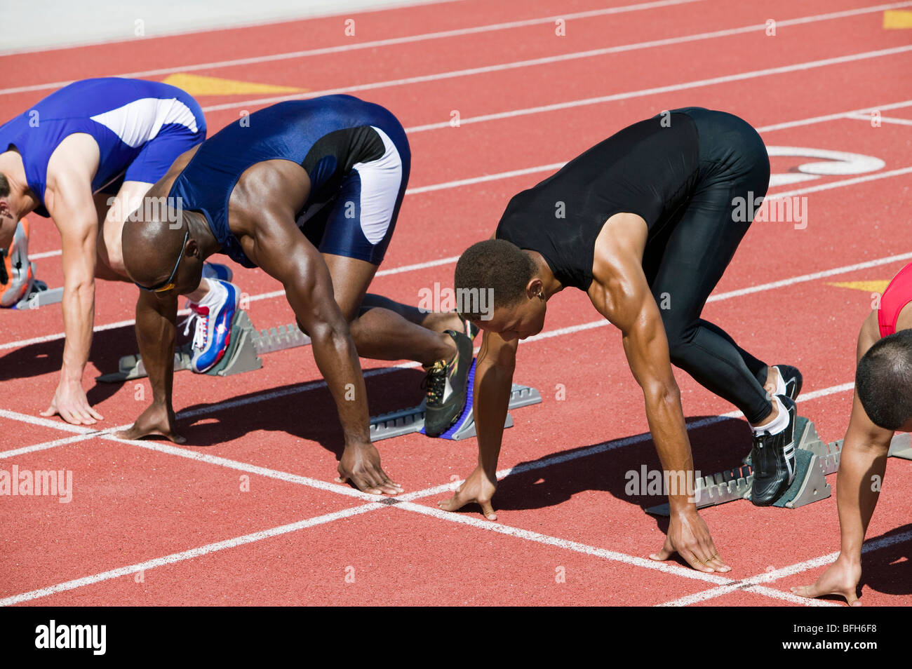 Male sprinters in starting blocks Stock Photo Alamy