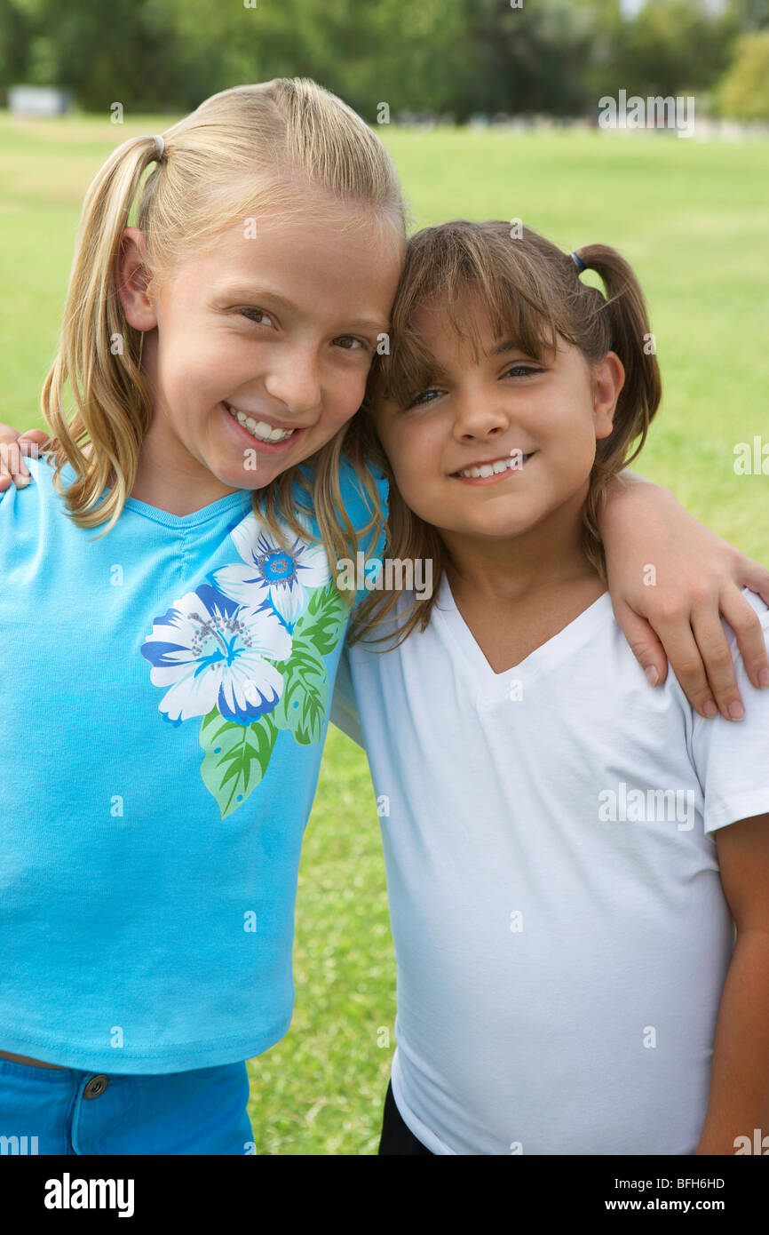 Two girls (7-9 years) hugging, portrait Stock Photo