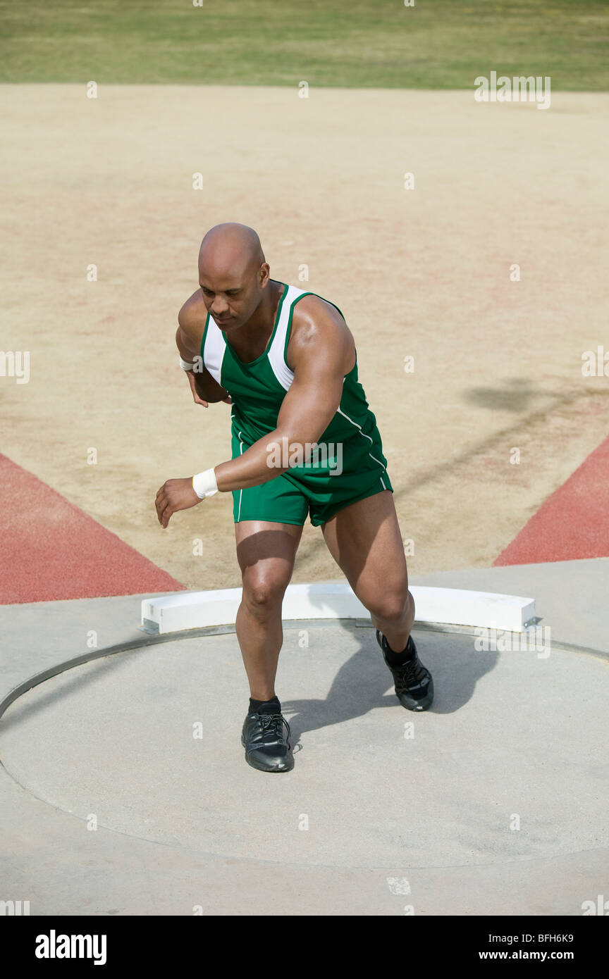 Male athlete training with discus in circle Stock Photo Alamy