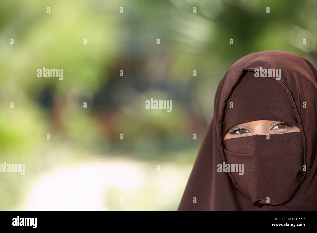 Portarit of young woman in brown niqab Stock Photo