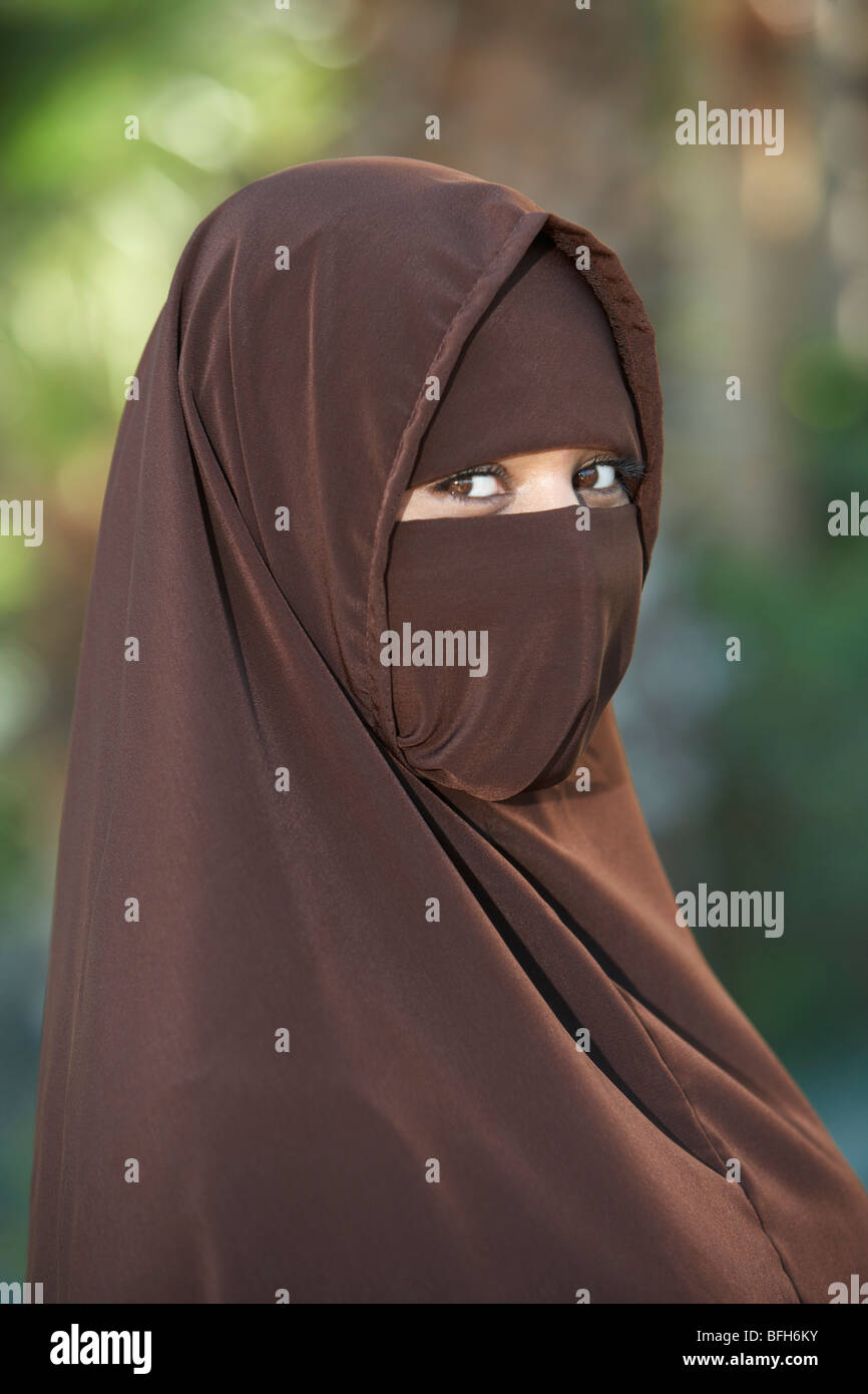 Portarit of young woman in brown niqab Stock Photo