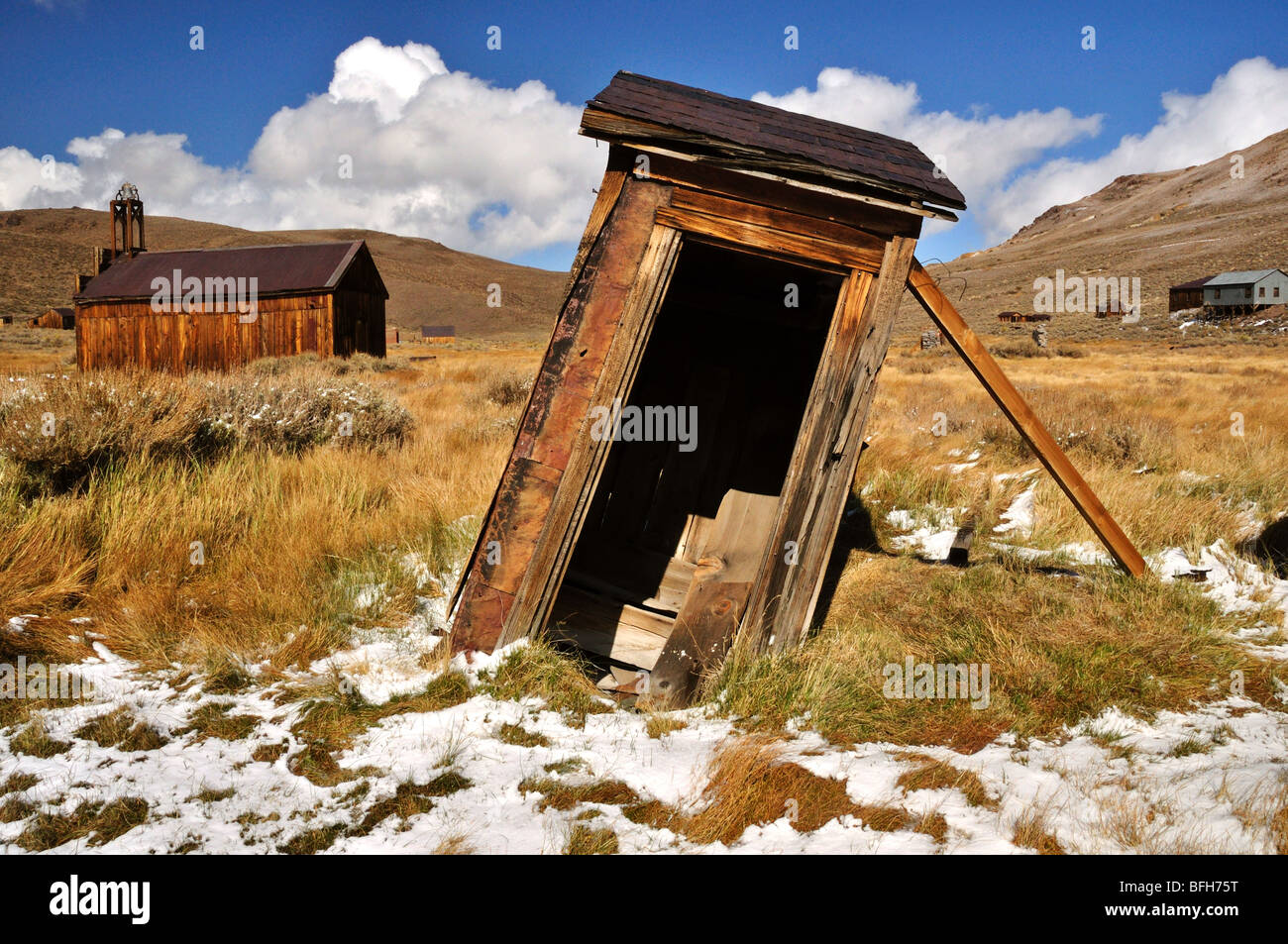 Leaning outhouse, Bodie, California Stock Photo