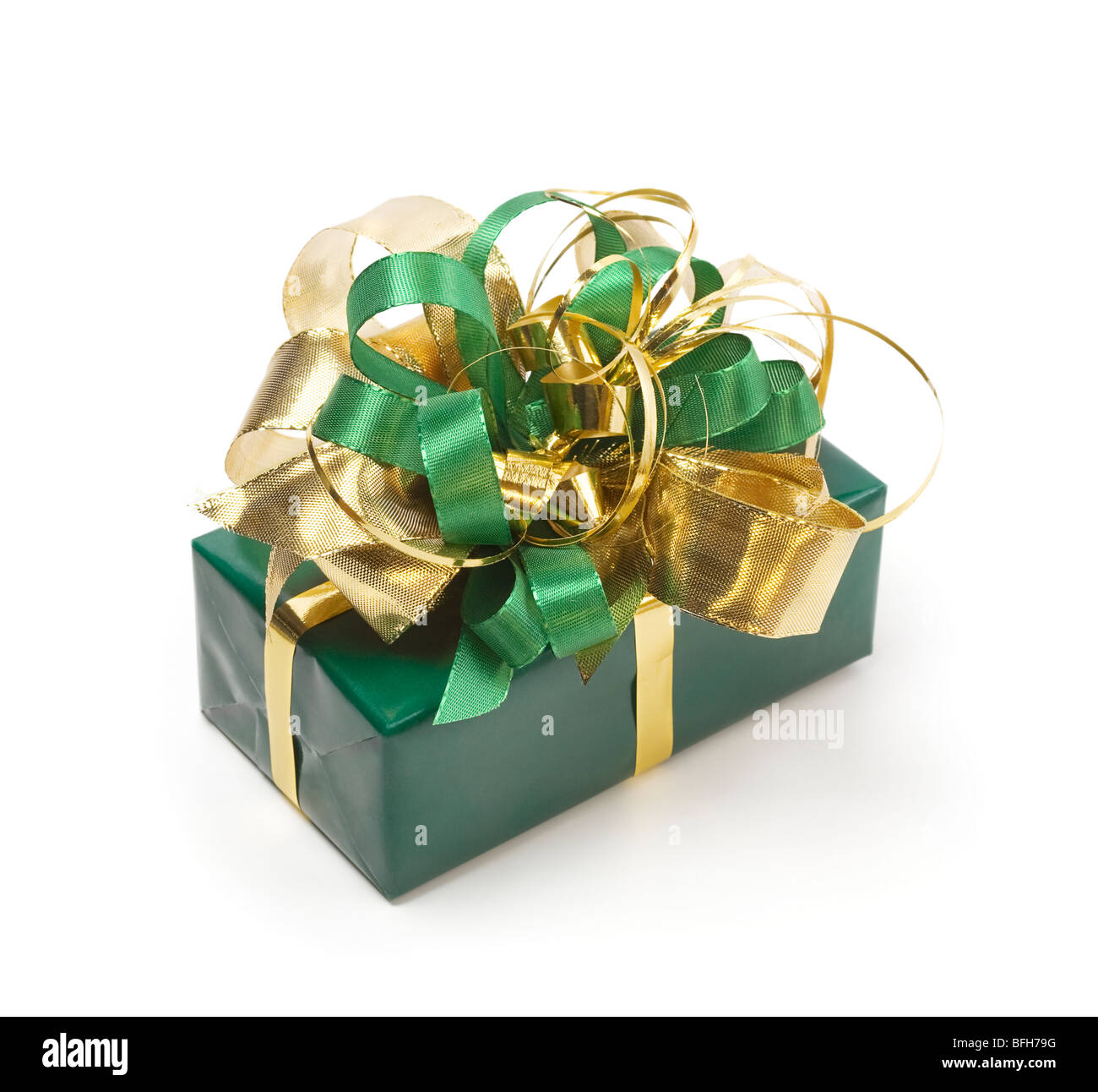 Green present with green and gold ribbons Stock Photo