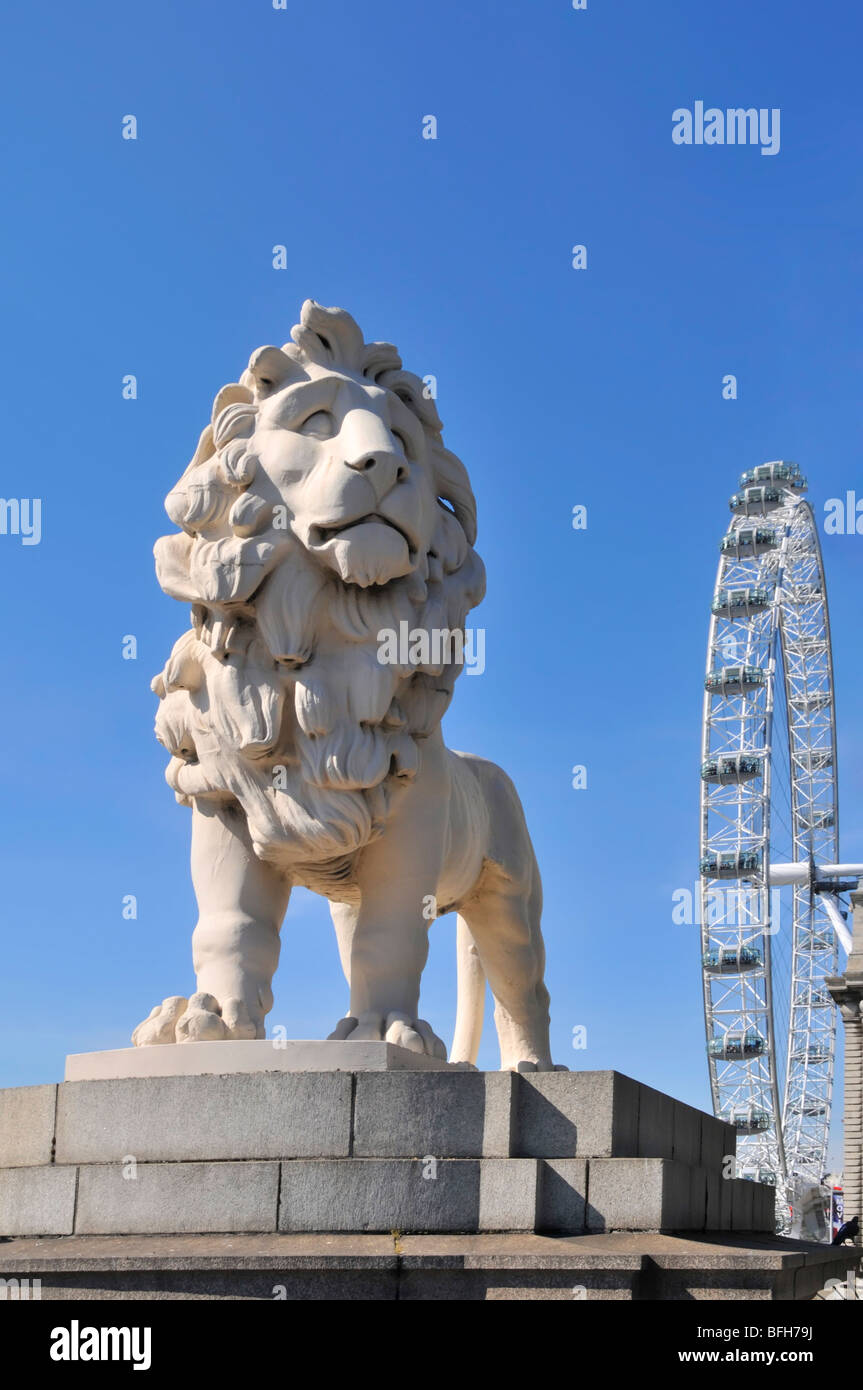 Historical statue of the South Bank Coade stone sculpture of male Lion on a blue sky day at the Lambeth end of  Westminster Bridge London England UK Stock Photo