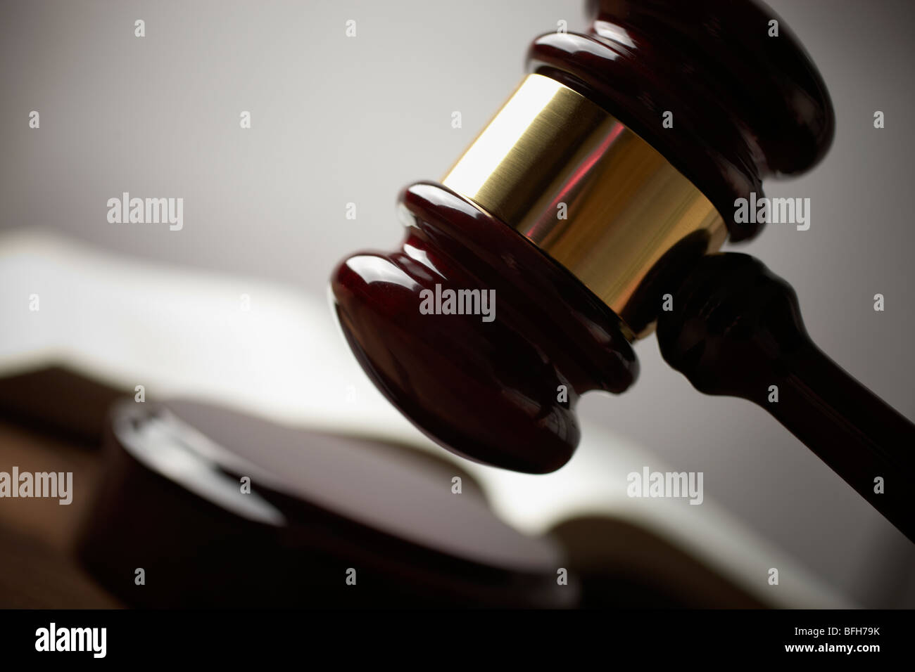 juridical concept with hammer and lawbook, selective focus on metal part,toned f/x Stock Photo