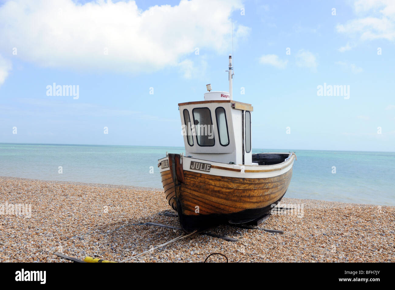 traditional fishing boat moored on beach Stock Photo - Alamy