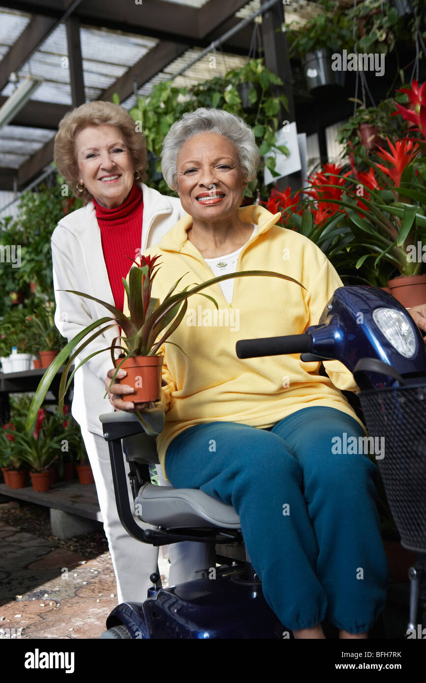 Two senior women in garden center Stock Photo - Alamy