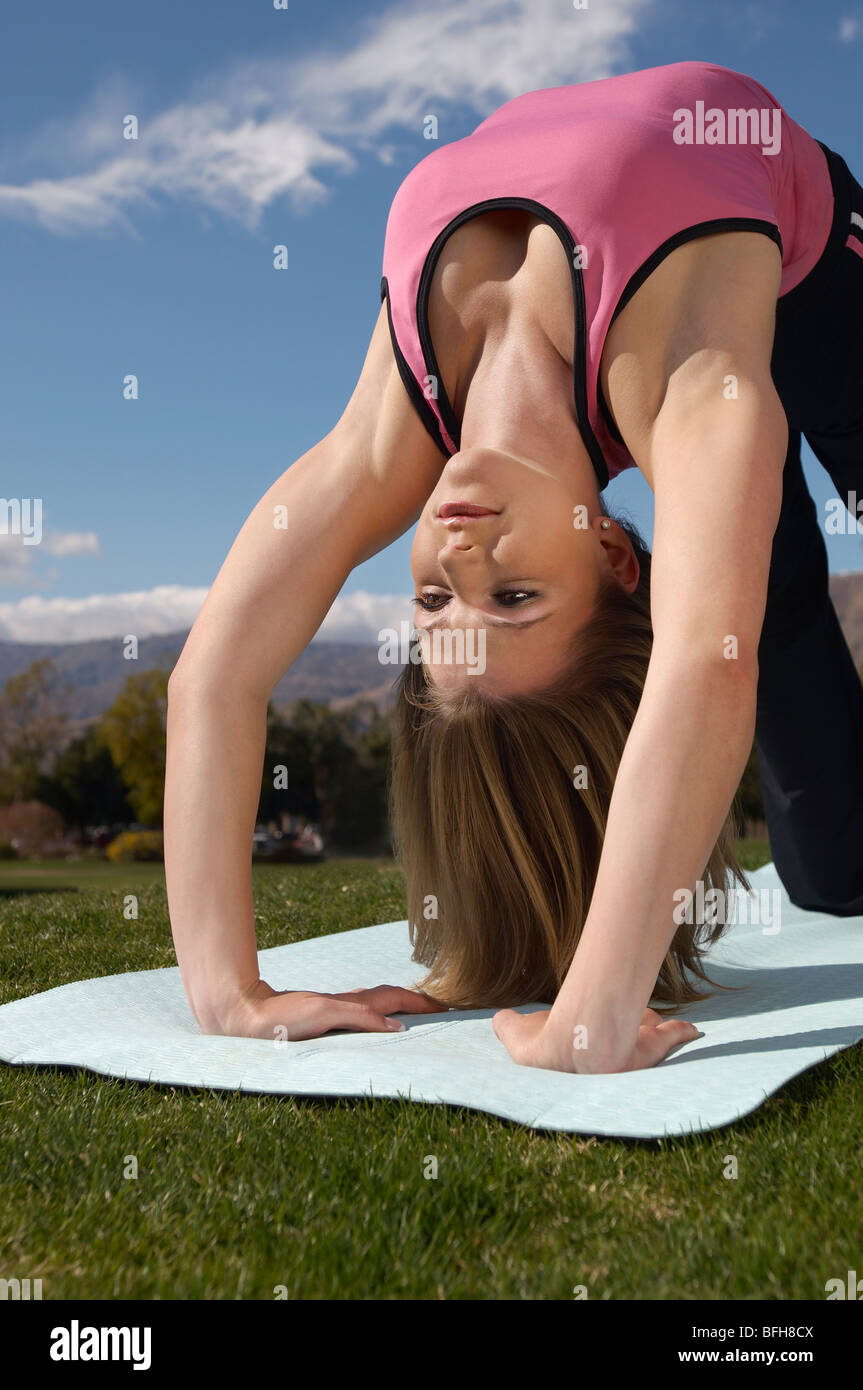 Young woman exercising in park Stock Photo - Alamy