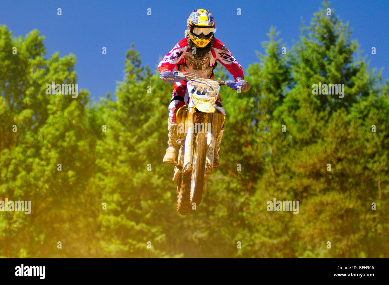 motocross racer at a jump during motocross action at the Wastelands in Nanaimo, BC. Stock Photo