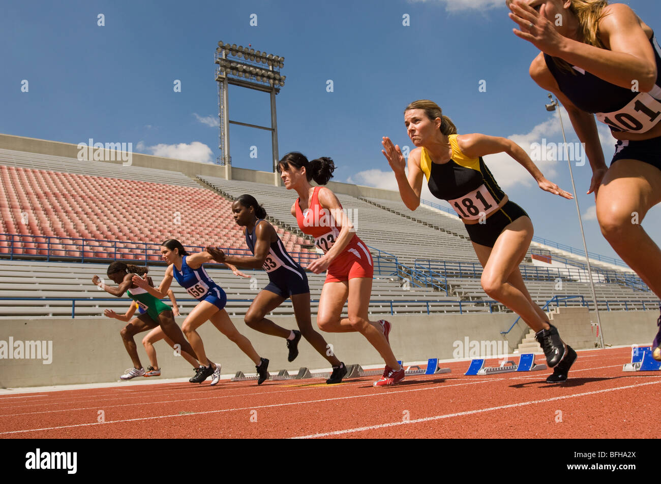 Group of female track athletes sprinting Stock Photo Alamy