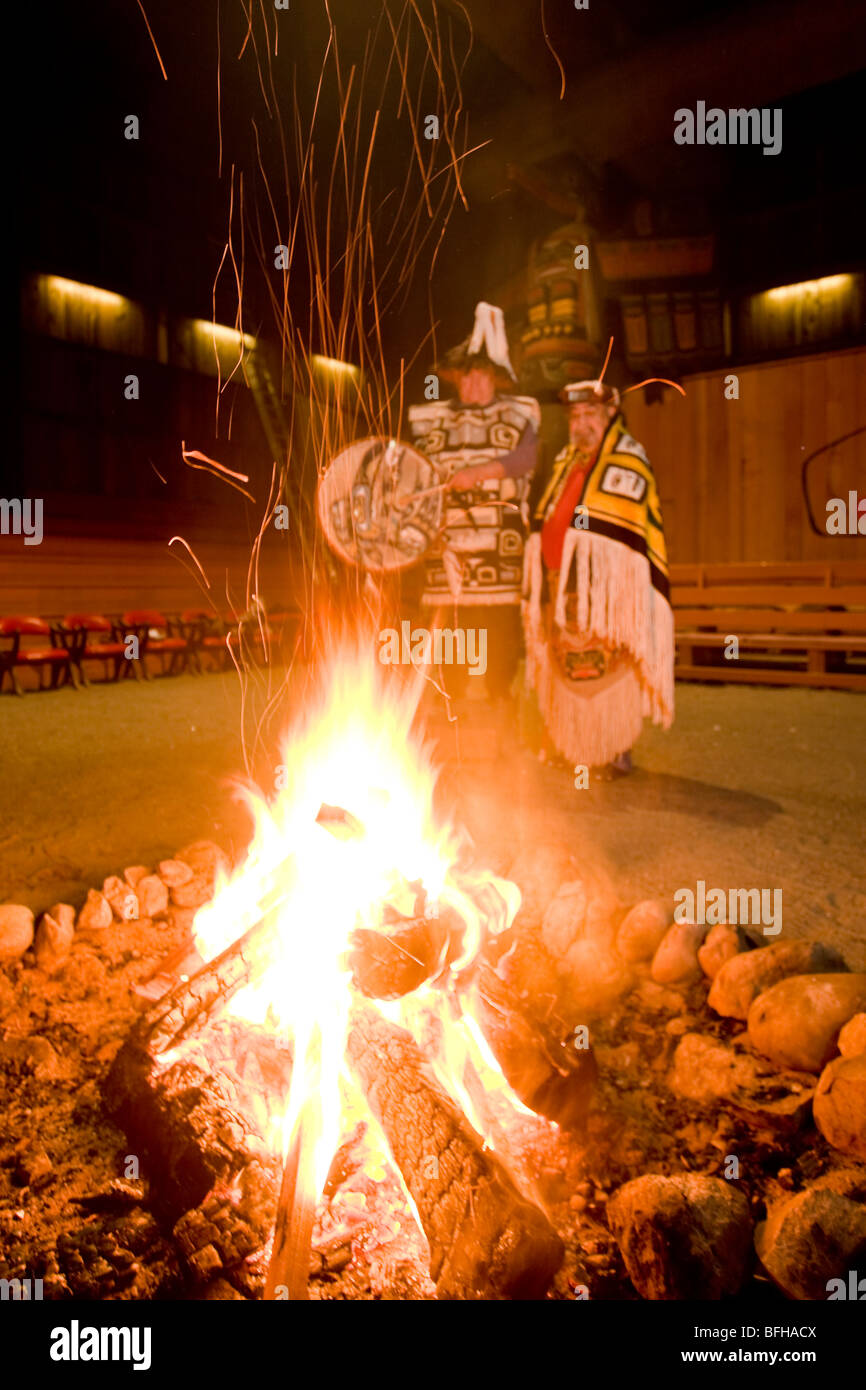 Two Hereditary chiefs preside over a fire  in longhouse in Port Rupert.  Port Rupert Vancouver Island British Columbia Canada. Stock Photo